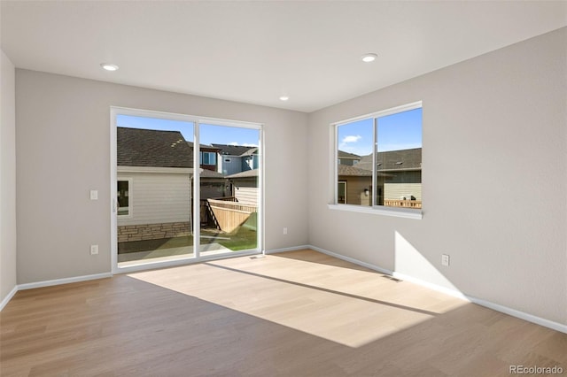 spare room featuring light wood-type flooring