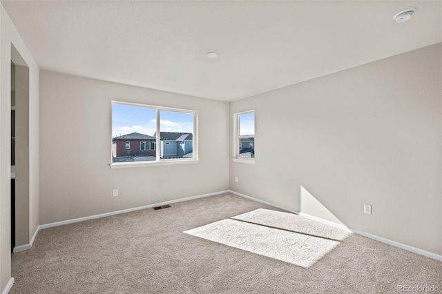 unfurnished room featuring carpet