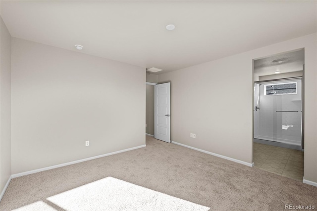 unfurnished bedroom with light carpet