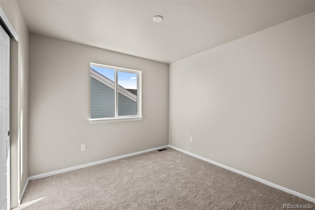 empty room with carpet flooring