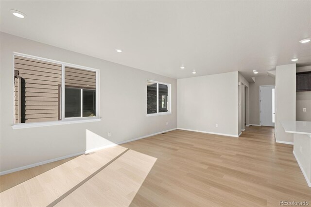 unfurnished living room featuring light hardwood / wood-style floors