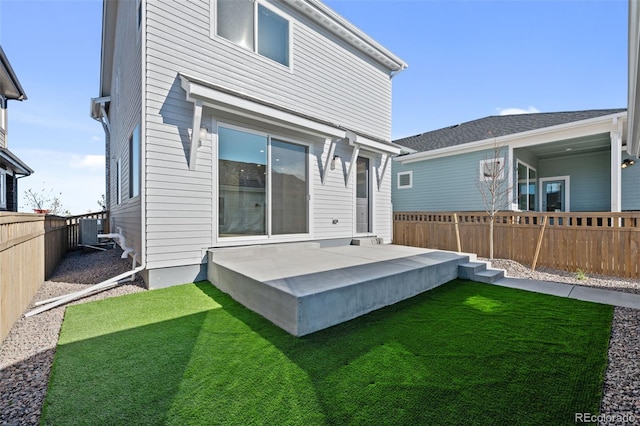 back of property featuring a yard and a patio area