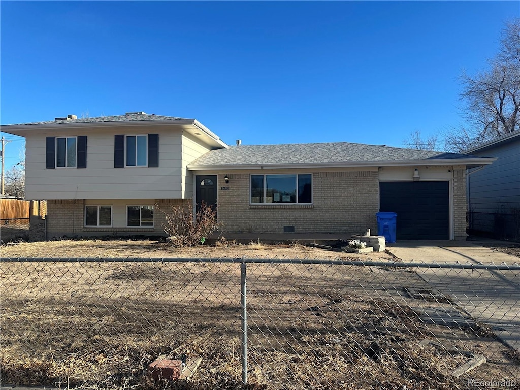 split level home featuring a garage