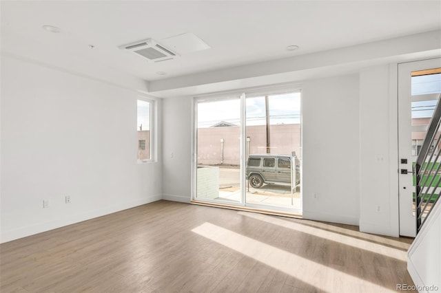 spare room featuring light wood-type flooring