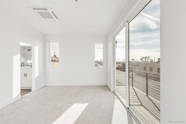 interior space featuring light carpet