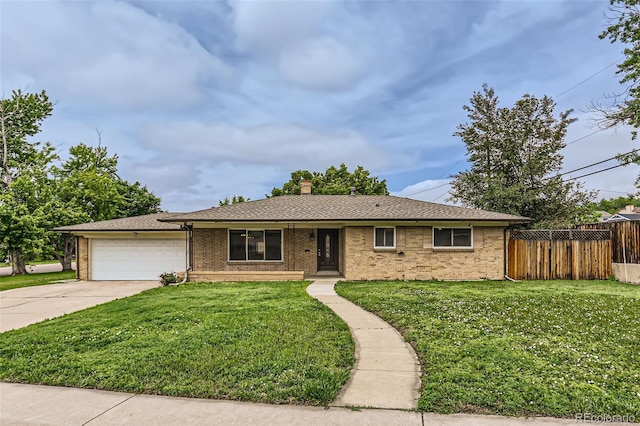 7995 Robin Ln, Denver, CO 80221 - ranch-style home featuring an attached garage, driveway, a chimney, and brick siding