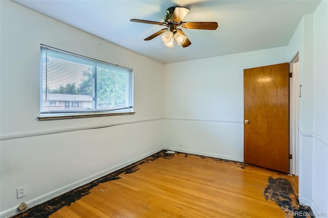 7995 Robin Ln, Denver, CO 80221 - unfurnished room featuring light wood-type flooring, ceiling fan, and baseboards