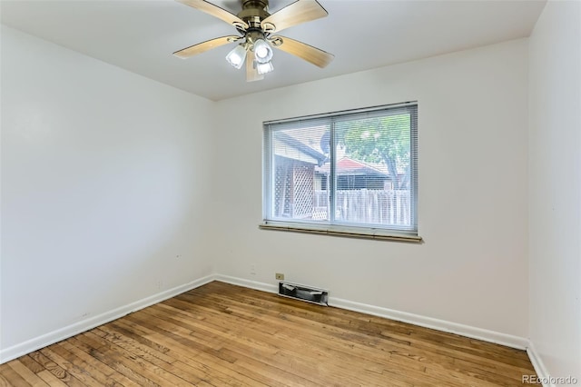 7995 Robin Ln, Denver, CO 80221 - unfurnished room with baseboards, wood finished floors, and a ceiling fan