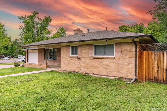 7995 Robin Ln, Denver, CO 80221 - ranch-style home featuring an attached garage, a chimney, brick siding, and a shingled roof
