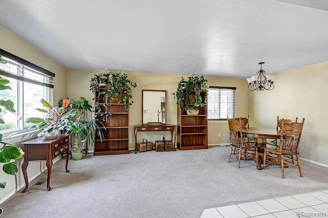 4863 Quail Ct, Frederick, CO 80504 - dining space featuring light carpet, a chandelier, a textured ceiling, and baseboards
