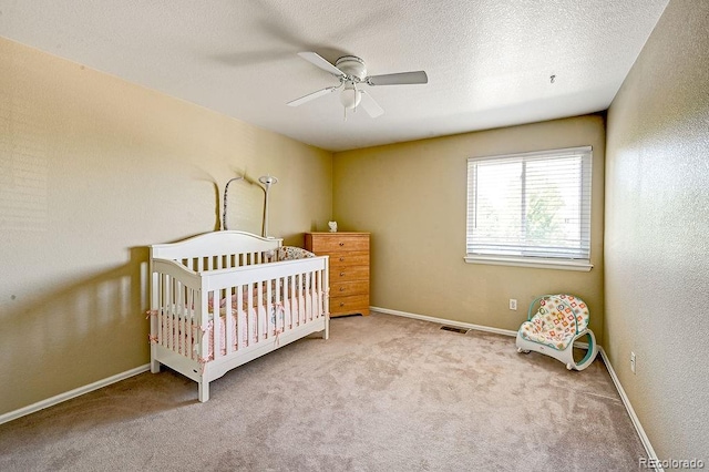 4863 Quail Ct, Frederick, CO 80504 - carpeted bedroom with a nursery area, baseboards, and a ceiling fan