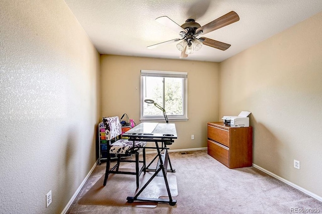 4863 Quail Ct, Frederick, CO 80504 - office area featuring ceiling fan, light colored carpet, baseboards, and a textured wall