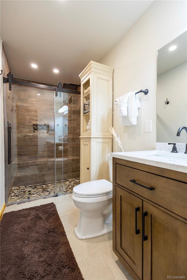 145 Arapahoe Rd Unit 102, Winter Park, CO 80482 - bathroom with toilet, a shower stall, vanity, recessed lighting, and tile patterned flooring