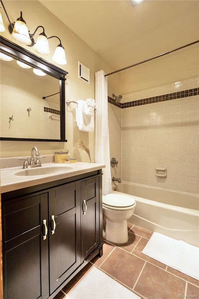 145 Arapahoe Rd Unit 102, Winter Park, CO 80482 - bathroom featuring shower / bath combo with shower curtain, tile patterned floors, vanity, and toilet
