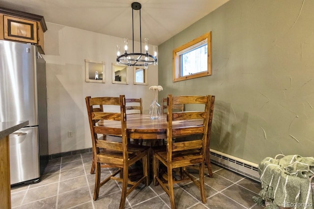 145 Arapahoe Rd Unit 102, Winter Park, CO 80482 - dining room with baseboard heating, a chandelier, and baseboards