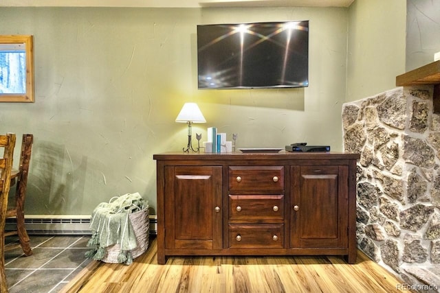 145 Arapahoe Rd Unit 102, Winter Park, CO 80482 - detailed view of a baseboard radiator and wood finished floors