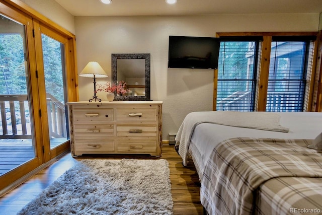 145 Arapahoe Rd Unit 102, Winter Park, CO 80482 - bedroom with multiple windows, access to outside, wood finished floors, and recessed lighting