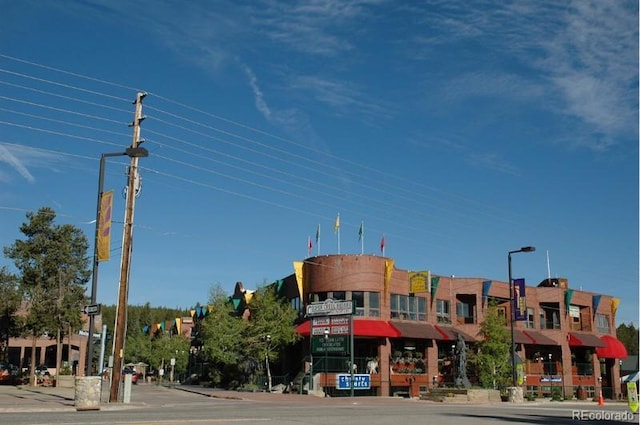 145 Arapahoe Rd Unit 102, Winter Park, CO 80482 - view of asphalt road featuring curbs, street lights, and sidewalks