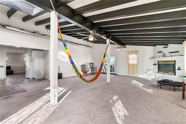 basement featuring white fridge and carpet floors