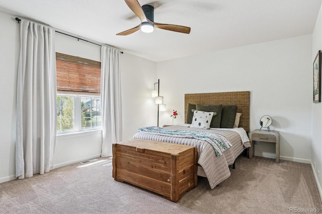 carpeted bedroom featuring visible vents, baseboards, and ceiling fan