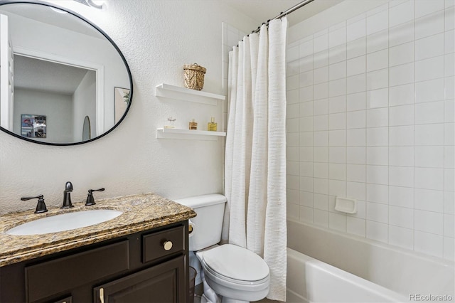 full bath with toilet, shower / bath combo, and vanity