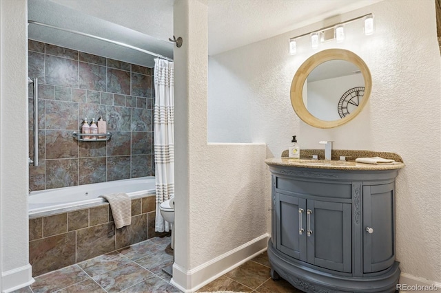 full bath with toilet, tiled shower / bath combo, vanity, tile patterned flooring, and a textured wall