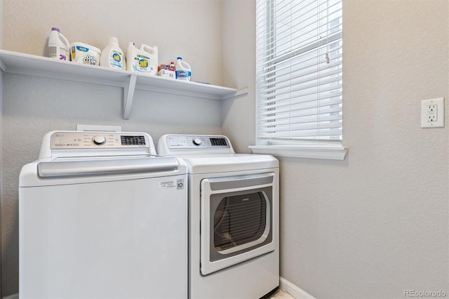 laundry area with independent washer and dryer