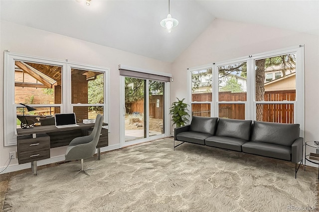 living room with high vaulted ceiling