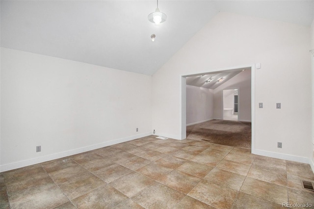 empty room with lofted ceiling