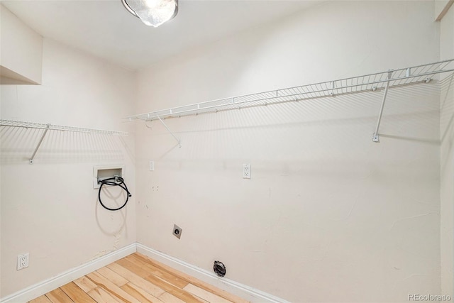 clothes washing area featuring wood-type flooring, washer hookup, and hookup for an electric dryer