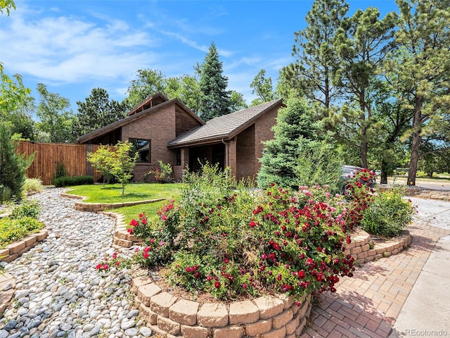 view of property exterior with a lawn