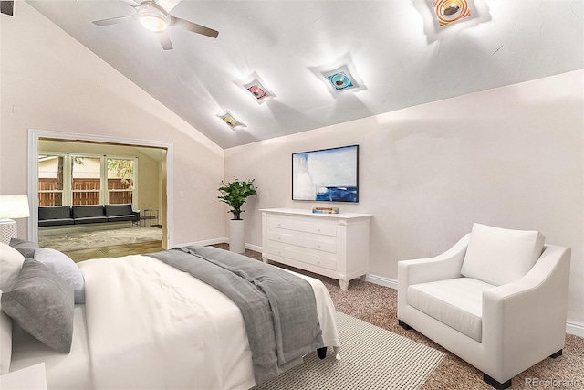 carpeted bedroom with ceiling fan and vaulted ceiling