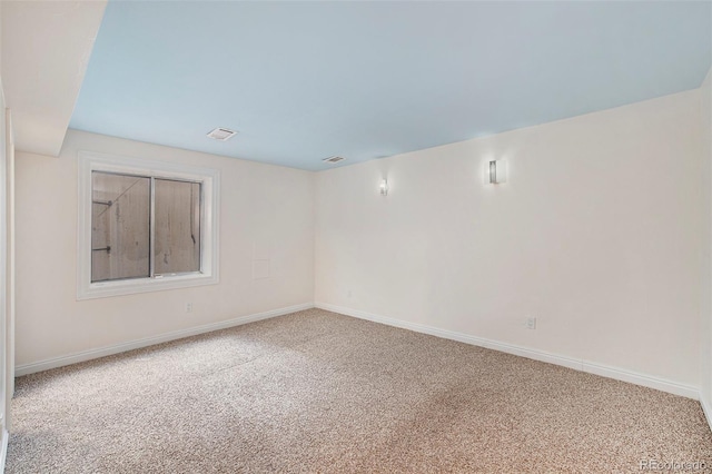 unfurnished room featuring carpet