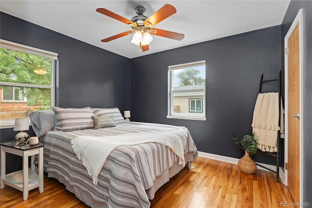 1540 Filbert Ct, Denver, CO 80220 - bedroom with wood finished floors, baseboards, and ceiling fan