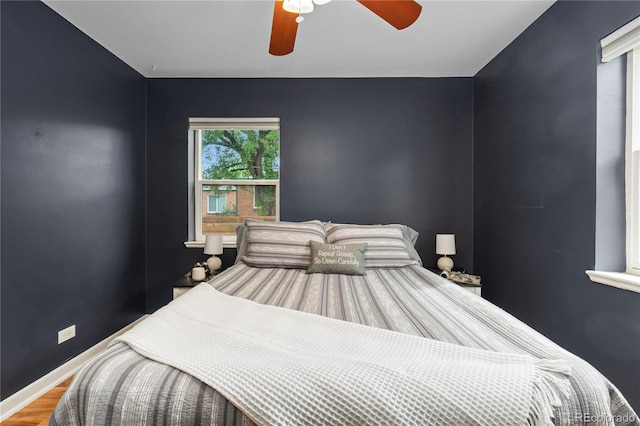 1540 Filbert Ct, Denver, CO 80220 - bedroom with wood finished floors, ceiling fan, and baseboards
