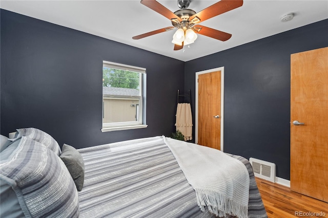 1540 Filbert Ct, Denver, CO 80220 - bedroom with wood finished floors, ceiling fan, and baseboards