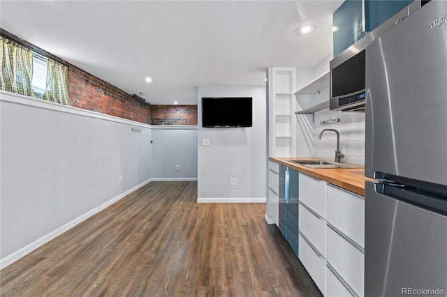 1540 Filbert Ct, Denver, CO 80220 - kitchen featuring freestanding refrigerator, a sink, wood counters, modern cabinets, and open shelves