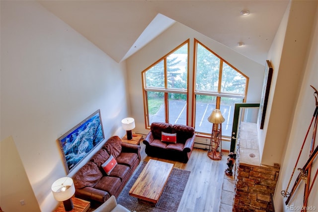 23110 US Highway 6 Unit 5040, Keystone, CO 80435 - living room featuring vaulted ceiling and wood finished floors