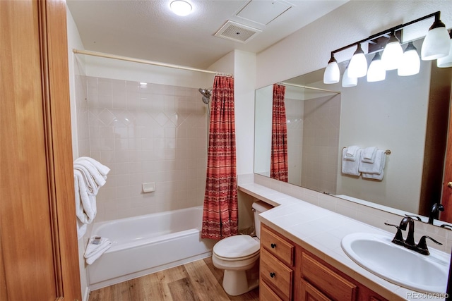 23110 US Highway 6 Unit 5040, Keystone, CO 80435 - full bathroom with vanity, wood finished floors, and shower / bath combination with curtain