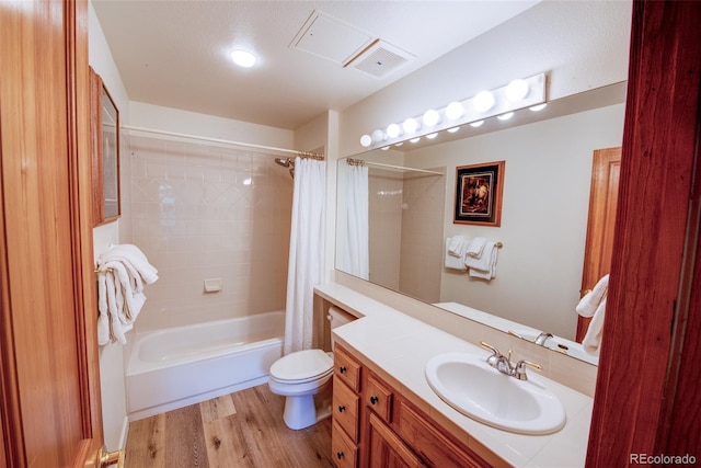 23110 US Highway 6 Unit 5040, Keystone, CO 80435 - full bathroom with vanity, wood finished floors, and shower / tub combo with curtain