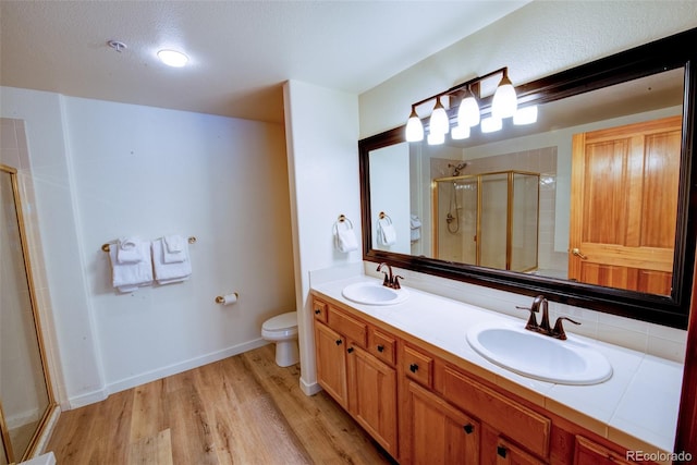 23110 US Highway 6 Unit 5040, Keystone, CO 80435 - full bath with a shower stall, wood finished floors, and double vanity