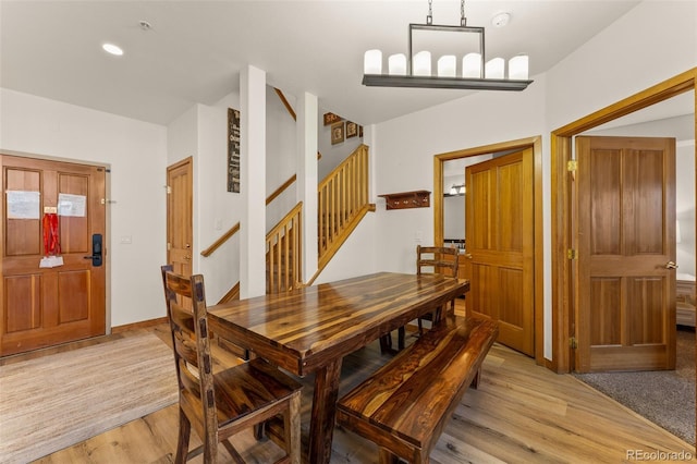 23110 US Highway 6 Unit 5040, Keystone, CO 80435 - dining room featuring light wood-type flooring and stairs
