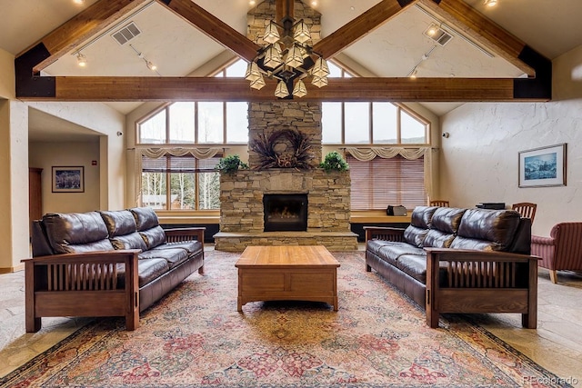 23110 US Highway 6 Unit 5040, Keystone, CO 80435 - living room with beamed ceiling, high vaulted ceiling, track lighting, and a stone fireplace
