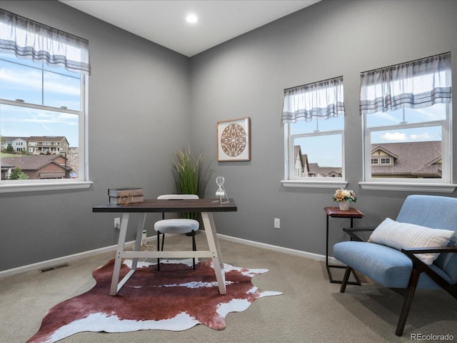 home office featuring carpet flooring, baseboards, and visible vents