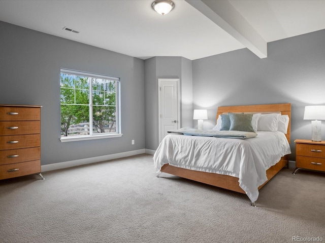 bedroom featuring visible vents, baseboards, and carpet floors