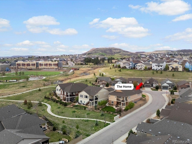 birds eye view of property featuring a mountain view and a residential view