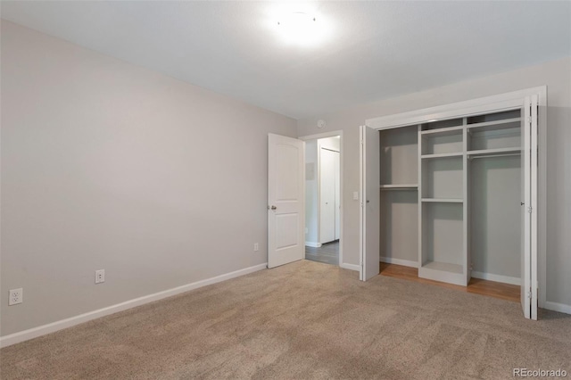 5770 E Warren Ave Unit 206, Denver, CO 80222 - unfurnished bedroom featuring carpet flooring and a closet