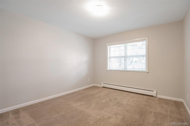 5770 E Warren Ave Unit 206, Denver, CO 80222 - carpeted empty room with a baseboard heating unit and baseboards