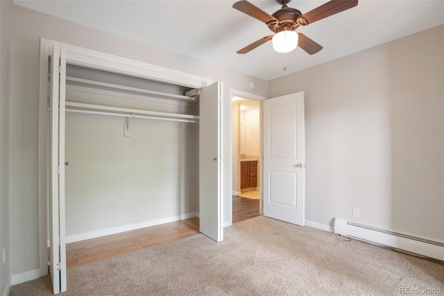 5770 E Warren Ave Unit 206, Denver, CO 80222 - unfurnished bedroom with carpet flooring, a baseboard radiator, and a closet