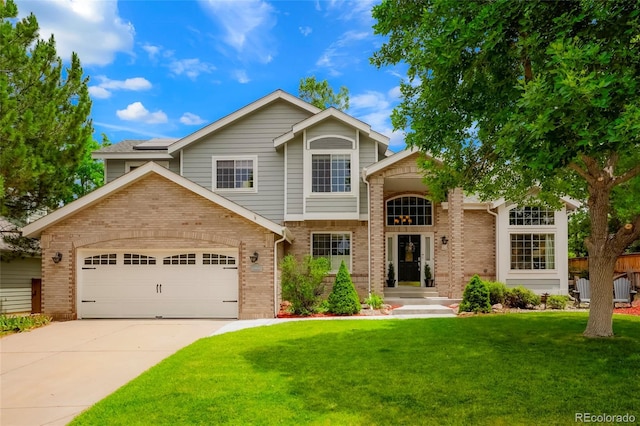 2061 Chesapeake Pl, Highlands Ranch, CO 80126 - traditional home with brick siding, a front lawn, driveway, and a garage